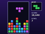 A falling-block puzzle with coloured pieces stacked in a well.