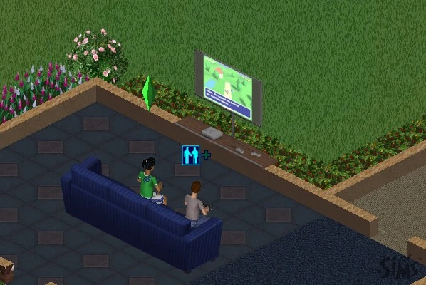 A wall-mounted TV above a shelf with a console, showing a game, with two Sims on a blue sofa playing with controllers.